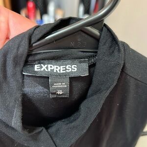 Sleeveless, high neck blouse
